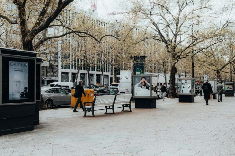Urban DOOH advertising screens in a city environment illustrating DOOH Audience Analytics