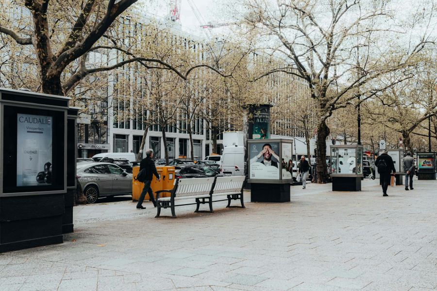 Urban DOOH advertising screens in a city environment illustrating DOOH Audience Analytics