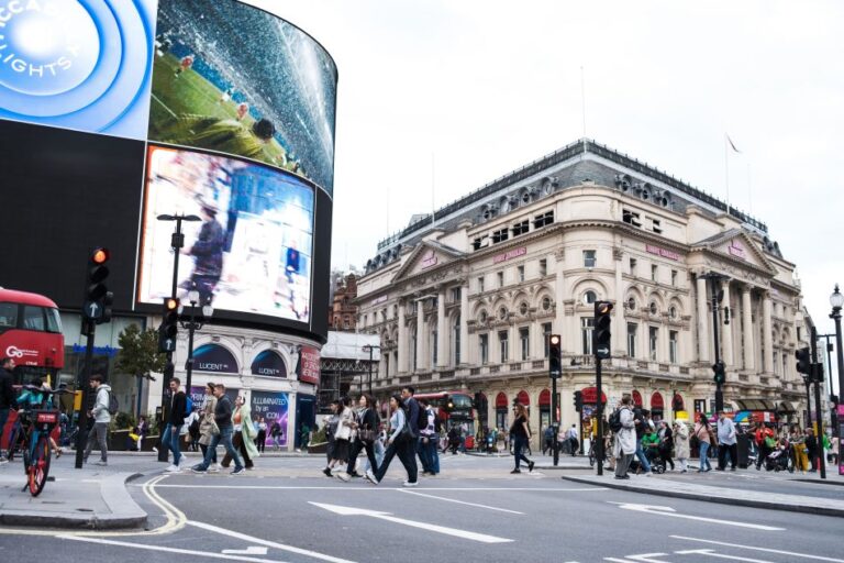 DOOH screens in a premium city location with pedestrians and high-value urban visibility