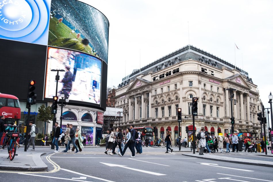 DOOH screens in a premium city location with pedestrians and high-value urban visibility